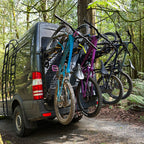 Four bikes mounted on Tokul Racks Panel Bike Rack on van rear door